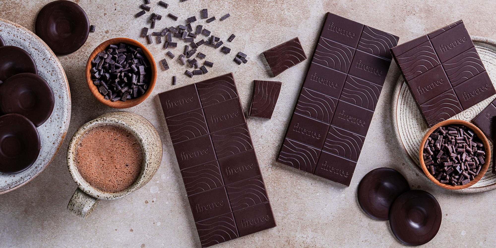A selection of vegan-friendly dark chocolate bars, chocolate thins and hot chocolate.